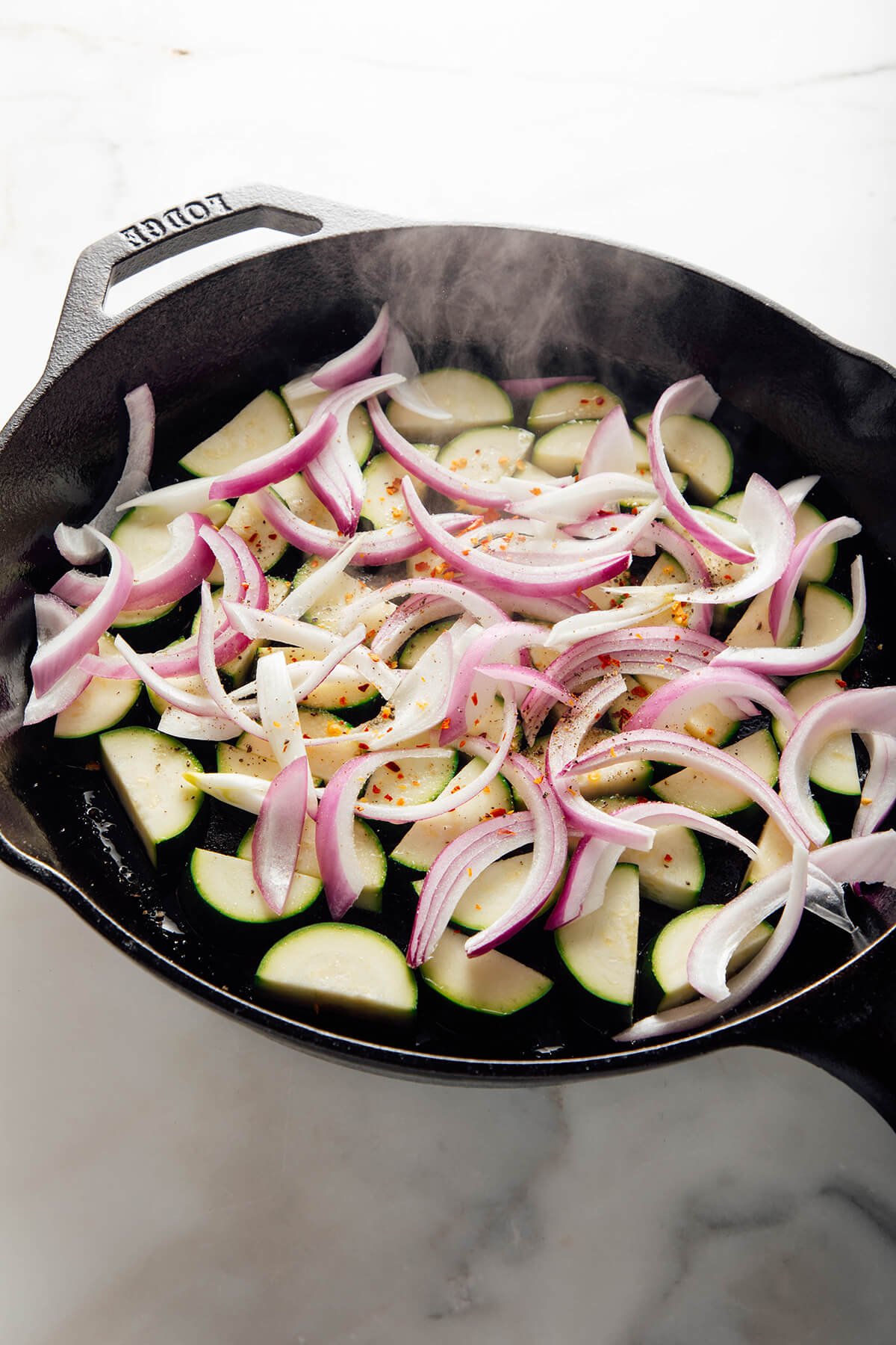 cooking the zucchini and onion